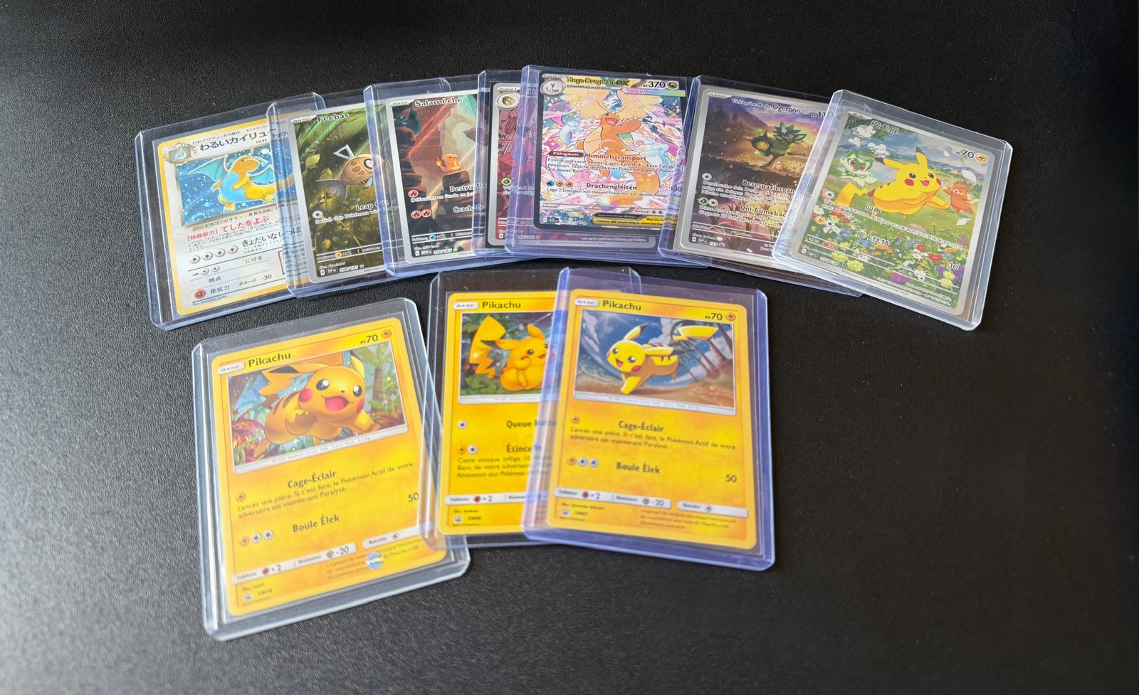 A selection of Pokémon cards in protective sleeves, ready to sell to CardBuyer